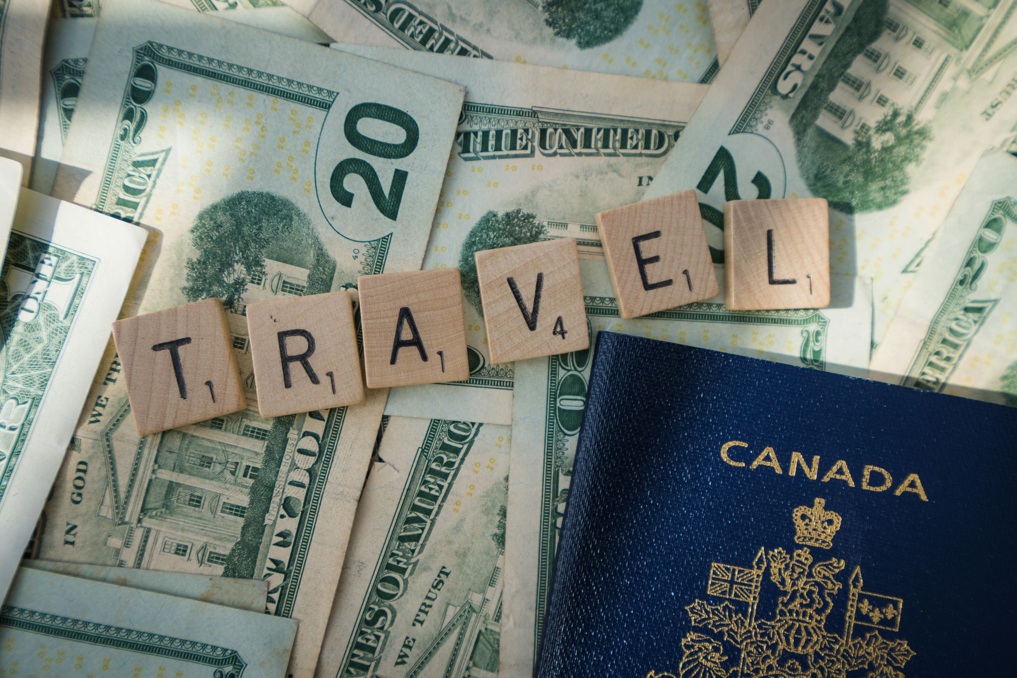  A passport and cash on a travel-themed background, promoting Best Travel Insurance for budget travelers.